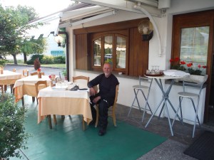 There mad us eat outside. Nice Italian restaurant, water and Pizza.