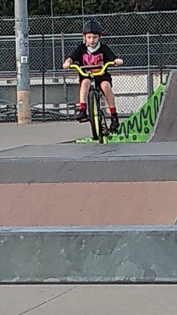 Grandson Caleb popping a wheelie